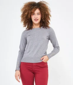 Maglia con bottoni ai polsi