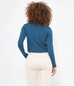 Maglia con bottoni ai polsi